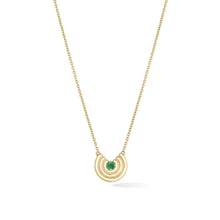 A delicate gold chain necklace featuring a crescent-shaped pendant with an emerald gemstone at the center, shown against a plain white background. May birthstone necklace gift