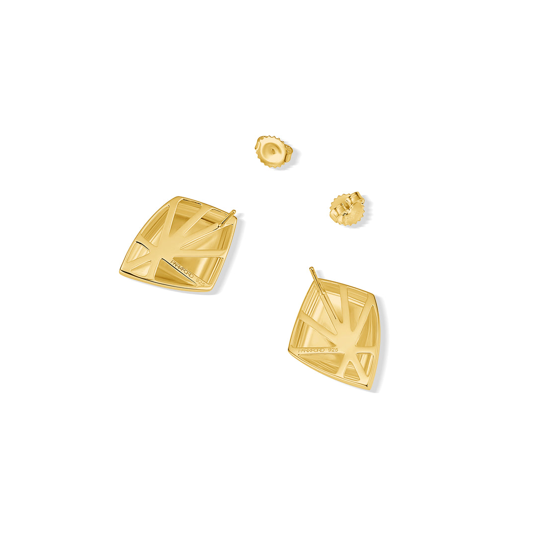 Close-up of geometric stud earring with framed back design.