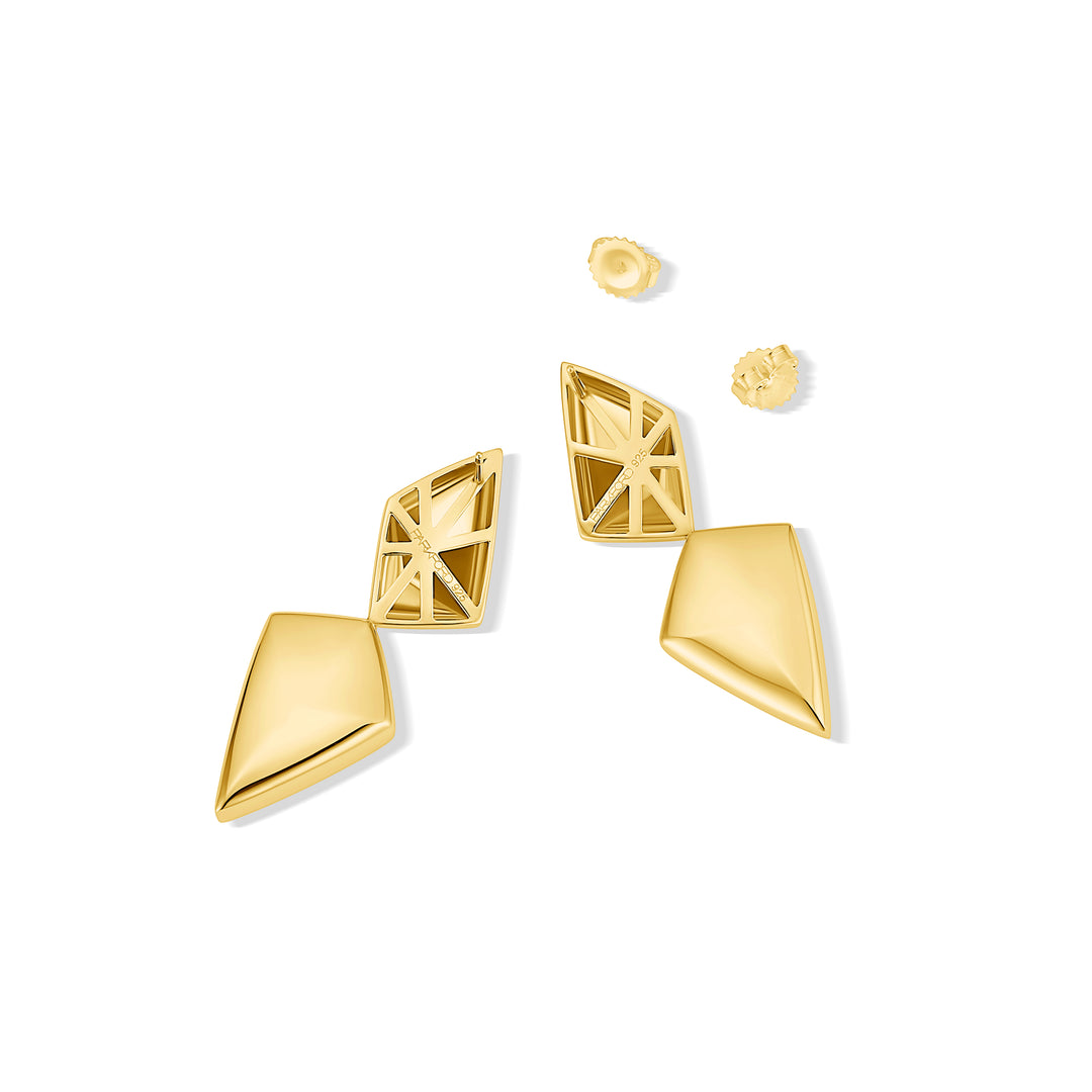 Gold geometric earrings on a white background